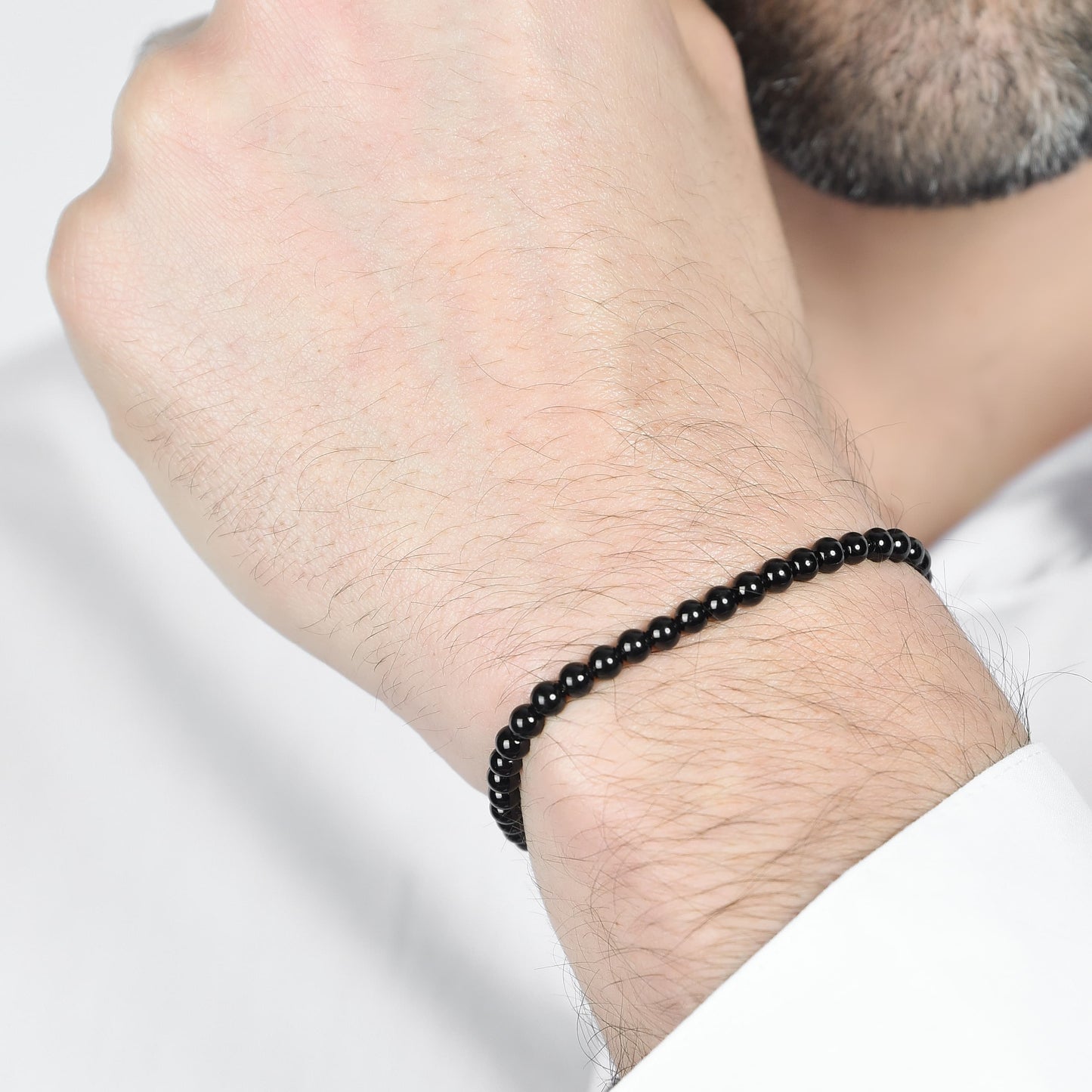 BRACCIALE UOMO IN ACCIAIO CON PERLE SINTETICHE NERE