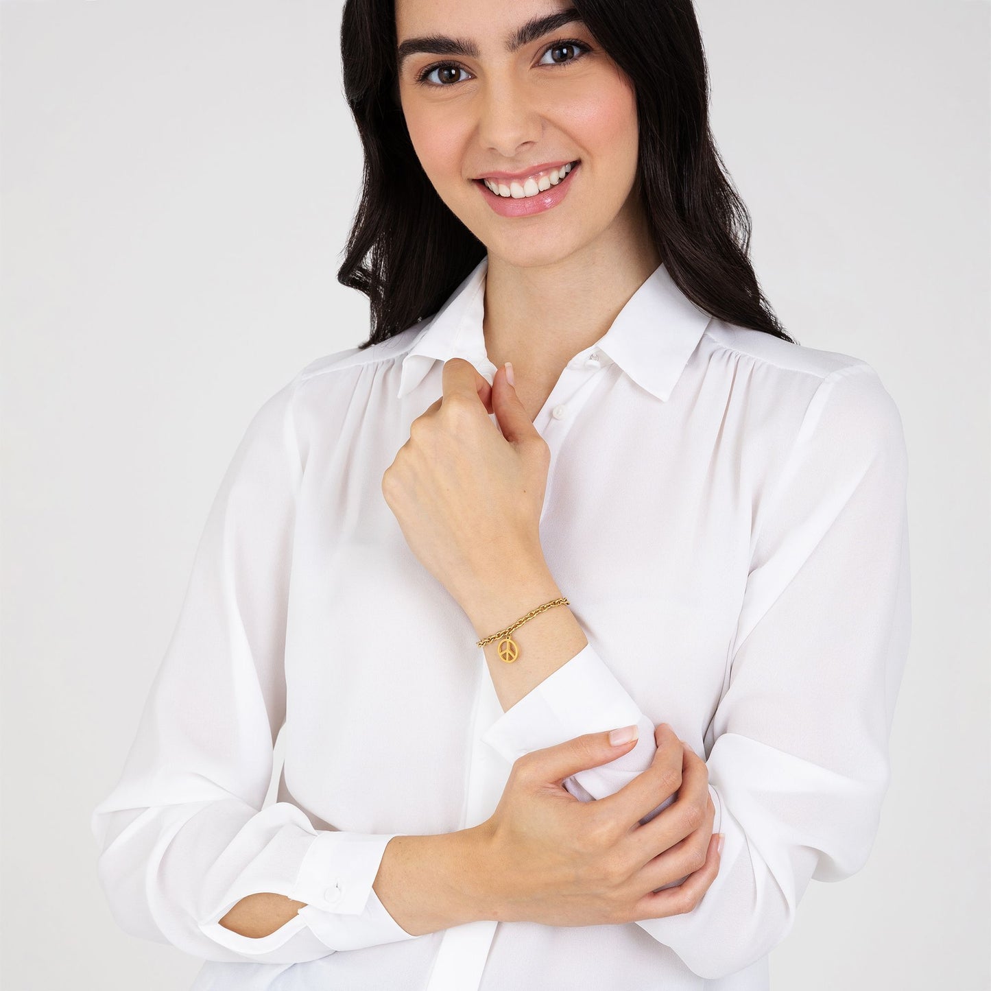 PULSERA DE ACERO DORADO PARA MUJER CON EL SÍMBOLO DE LA PAZ