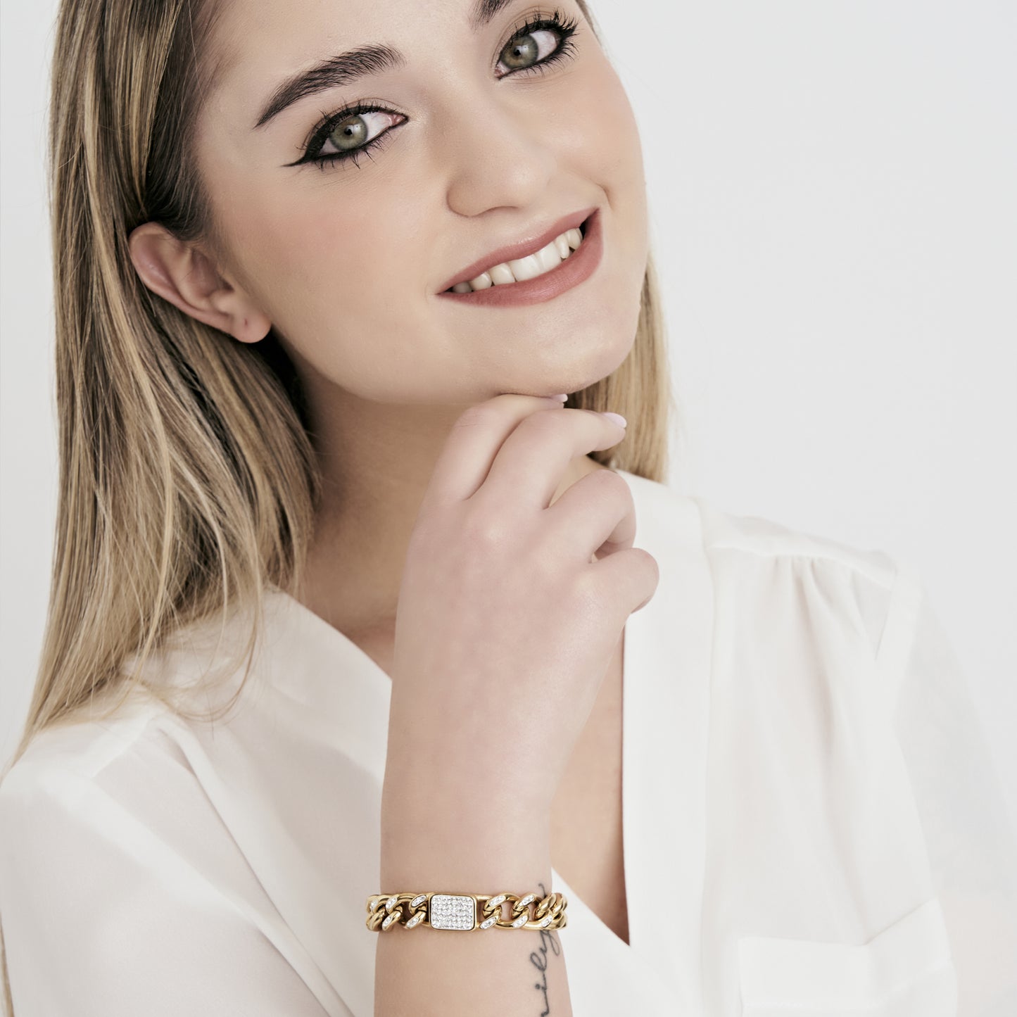 PULSERA DE MUJER DE ACERO DORADO Y CRISTAL BLANCO