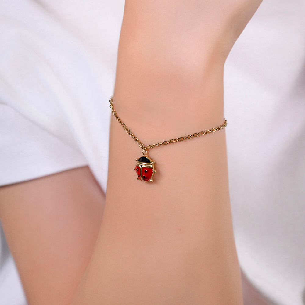 IP ORO ACERO PULSERA NIÑA CON MARIQUITA