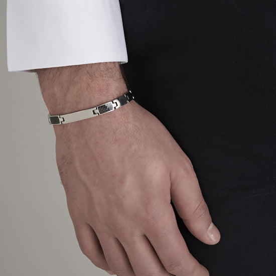 PULSERA DE HOMBRE CON PLACA DE ACERO Y ELEMENTOS NEGROS