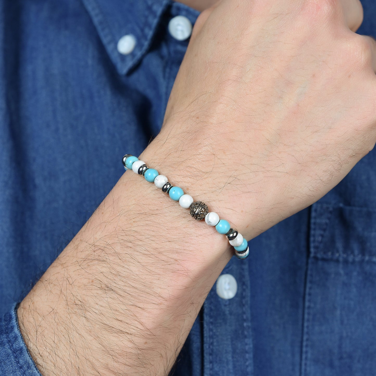 PULSERA ELÁSTICA DE CABALLERO CON PIEDRAS AZULES Y BLANCAS Y ELEMENTOS DE ACERO
