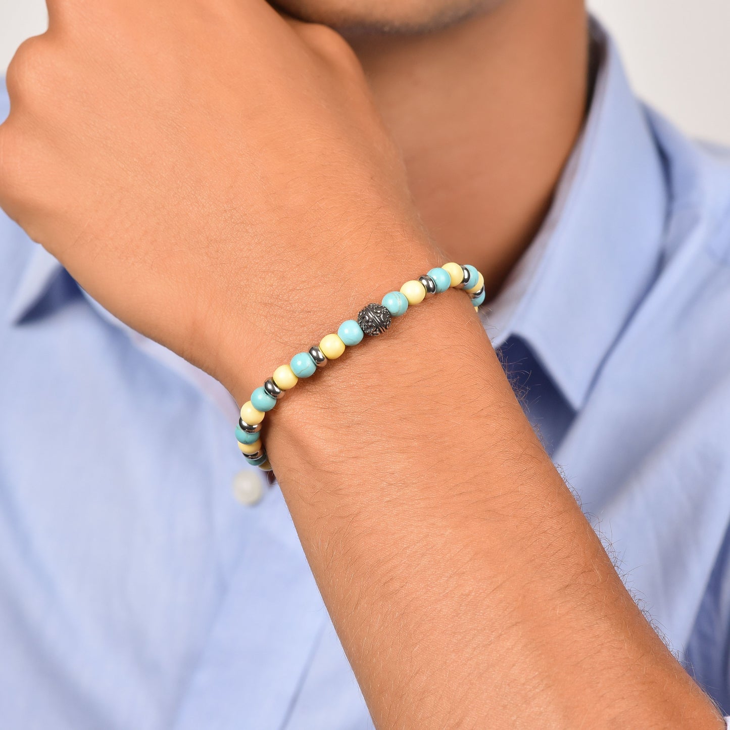 PULSERA ELÁSTICA DE HOMBRE CON PIEDRAS TURQUESAS Y AMARILLAS Y ELEMENTOS DE ACERO