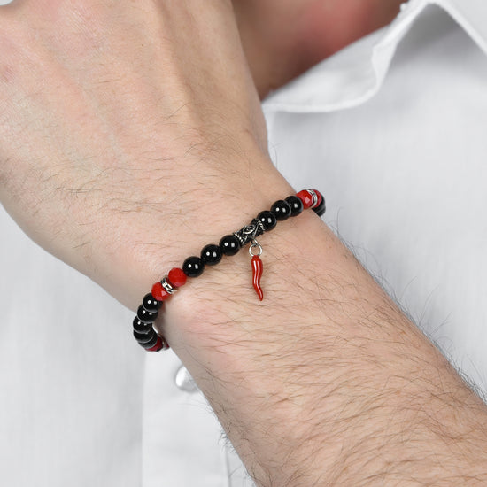 PULSERA ELÁSTICA DE HOMBRE CON PIEDRAS NEGRAS Y ROJAS Y CUERNO ROJO