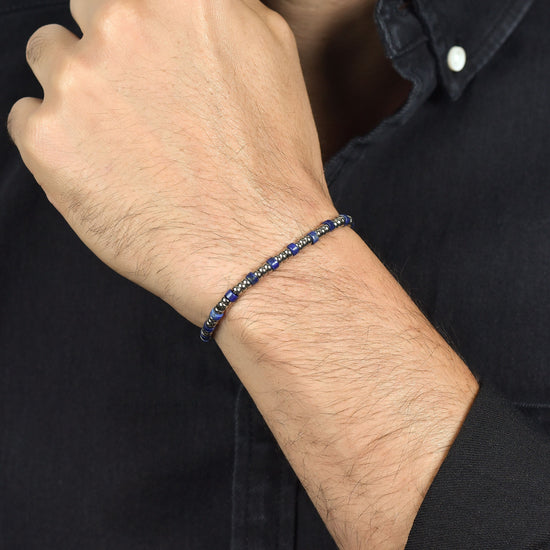 PULSERA DE ACERO PARA HOMBRE CON ELEMENTOS PLATEADOS Y PIEDRAS AZULES