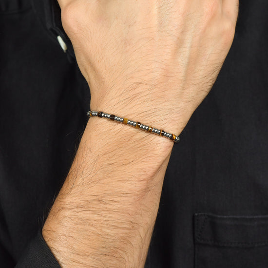 PULSERA DE ACERO PARA HOMBRE CON ELEMENTOS DE PLATA Y PIEDRAS DE OJO DE TIGRE