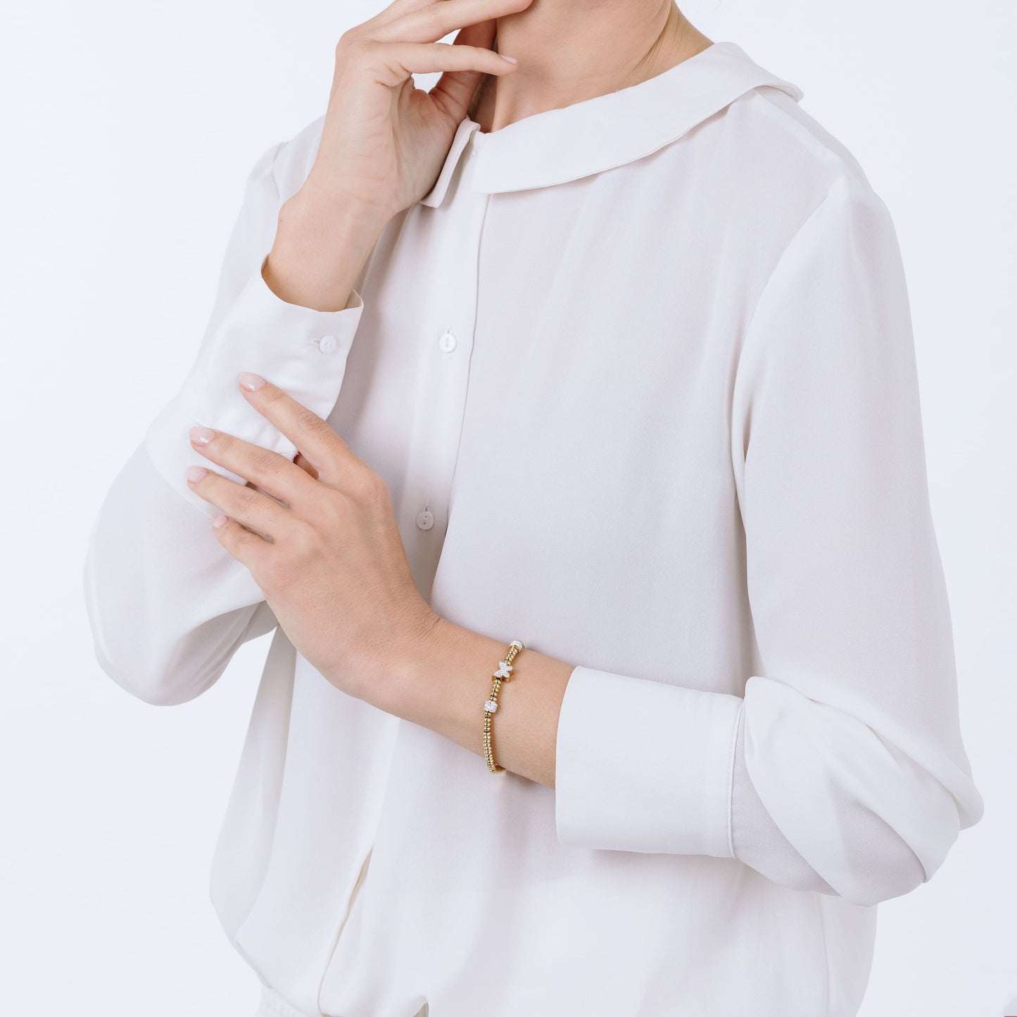 PULSERA DE ACERO DORADO CON MARIPOSA DE CRISTAL BLANCO