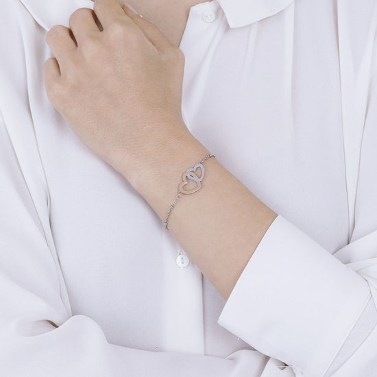 PULSERA DE ACERO CON CORAZONES DE ACERO Y ROSA IP DE ACERO