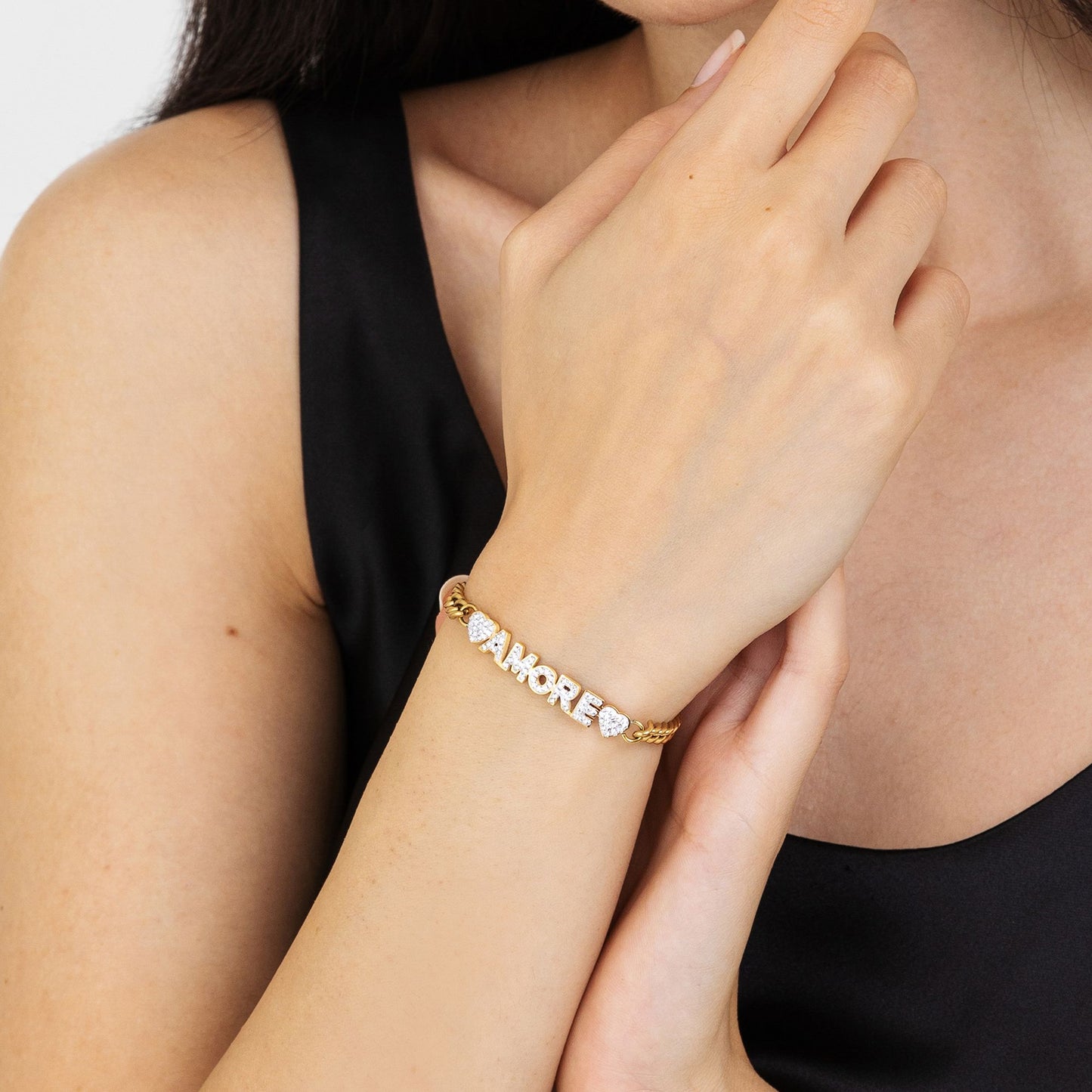 PULSERA DEL AMOR DE ACERO DORADO CON CRISTALES BLANCOS