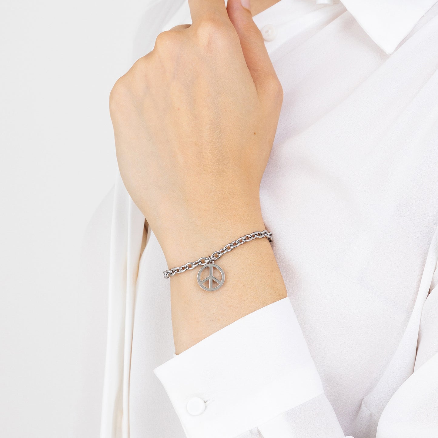 PULSERA DE ACERO PARA MUJER CON EL SÍMBOLO DE LA PAZ
