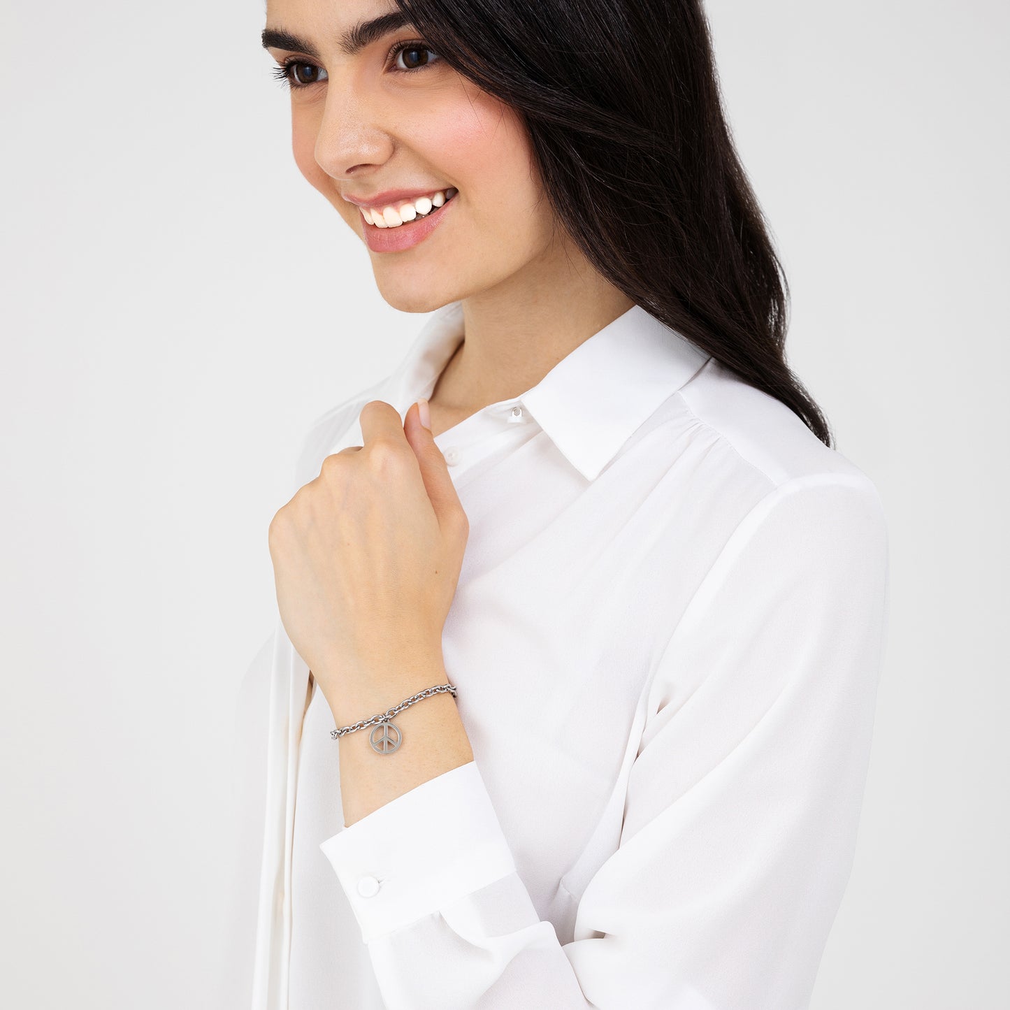 PULSERA DE ACERO PARA MUJER CON EL SÍMBOLO DE LA PAZ