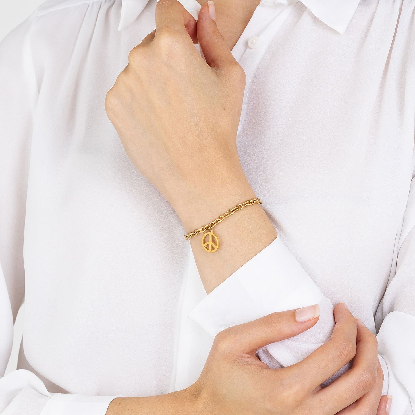 PULSERA DE ACERO DORADO PARA MUJER CON EL SÍMBOLO DE LA PAZ