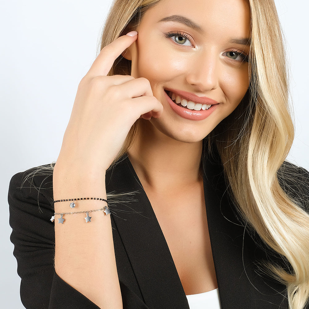 PULSERA DE ACERO PARA MUJER CON ESTRELLAS, ELEMENTOS IP NEGROS Y CRISTAL BLANCO