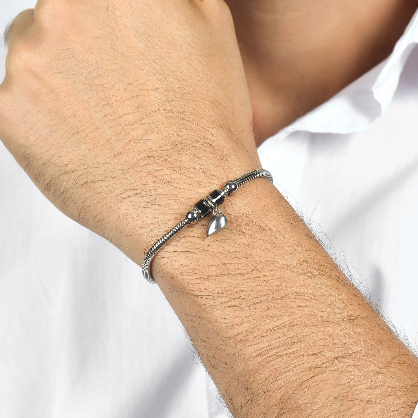 PULSERAS DE PAREJA DE ACERO CON MEDIO CORAZÓN IMANTADO