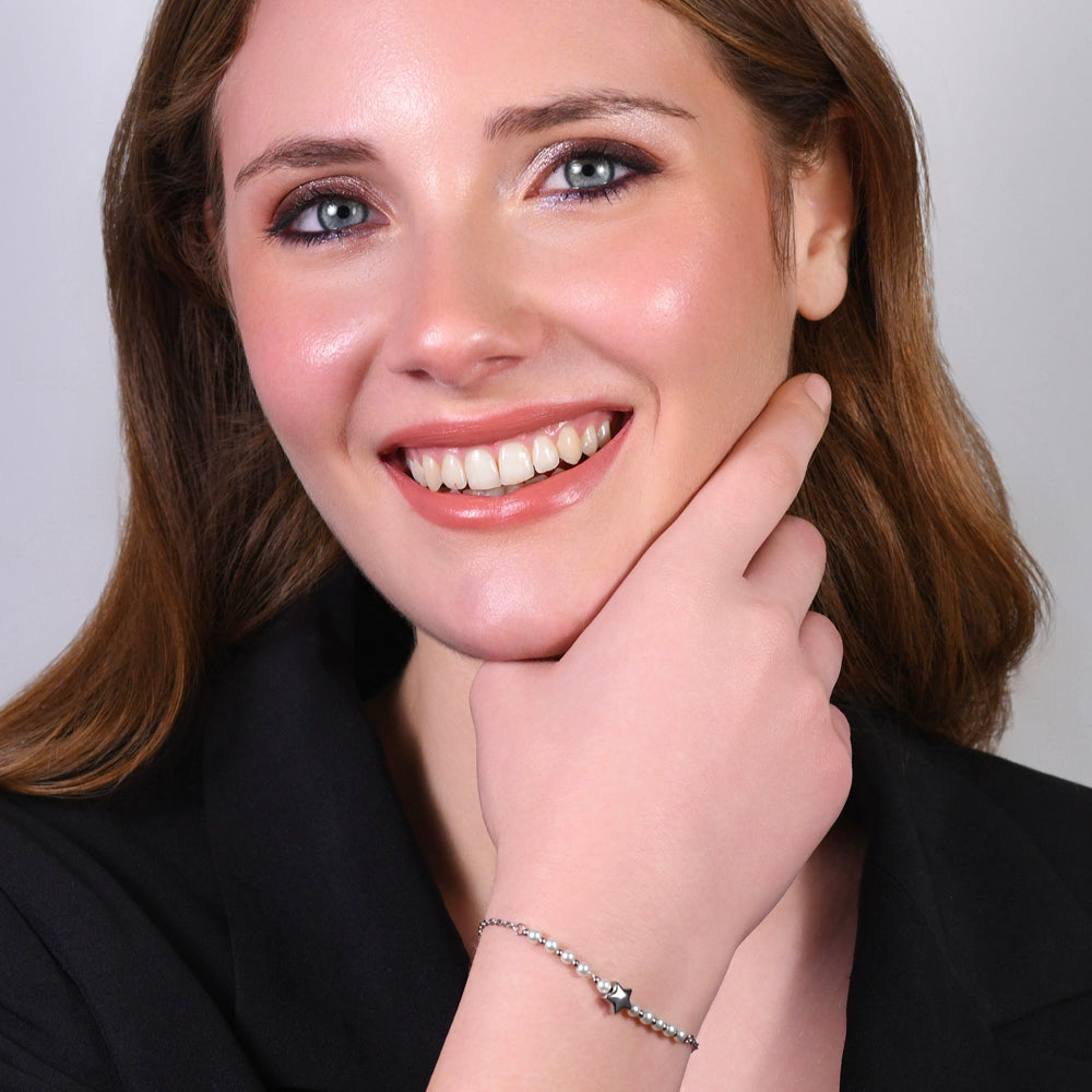 BRACCIALE DONNA IN ACCIAIO E PERLE BIANCHE CON STELLA