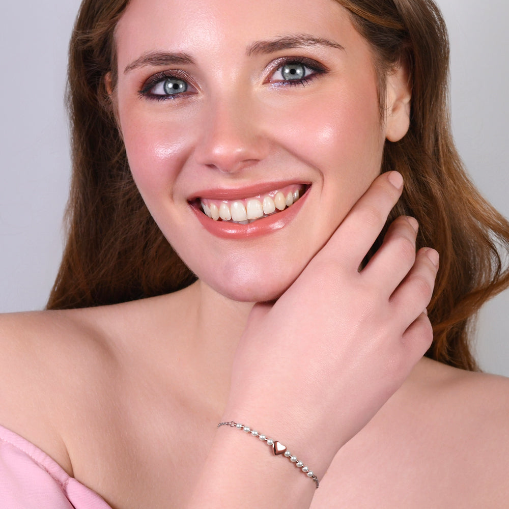 BRACCIALE DONNA IN ACCIAIO IP GOLD E PERLE SINTETICHE BIANCHE CON CUORE IP ROSE