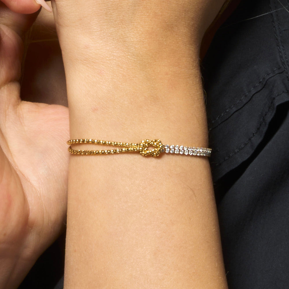 BRACCIALE DONNA IN ACCIAIO IP GOLD CON NODO E ZIRCONI BIANCHI