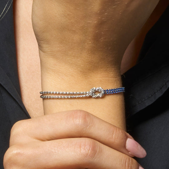 BRACCIALE DONNA IN ACCIAIO CON NODO E ZIRCONI BLU