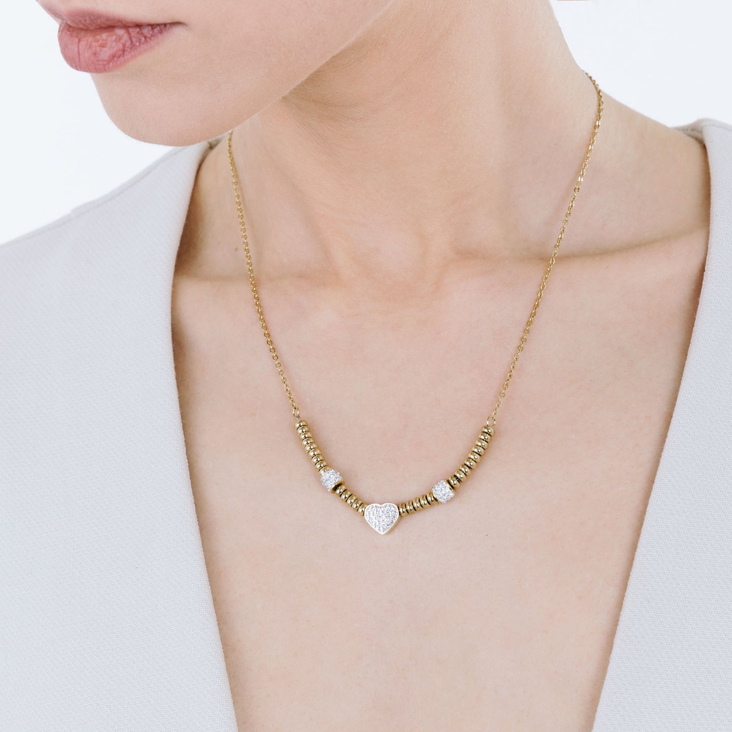 IP COLLAR DE ACERO DORADO CON CORAZÓN DE CRISTAL BLANCO