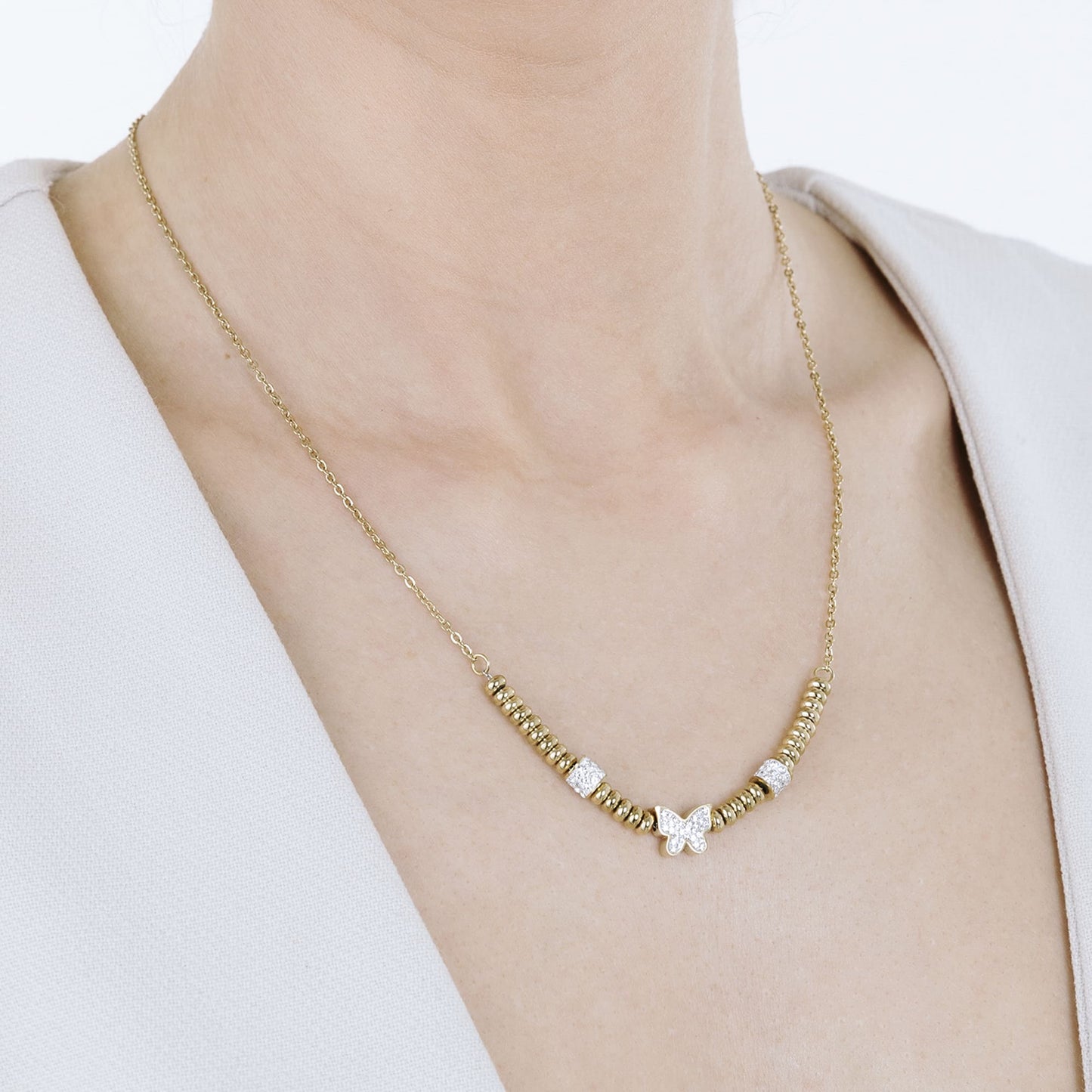 IP COLLAR DE ACERO DORADO CON MARIPOSA DE CRISTAL BLANCO