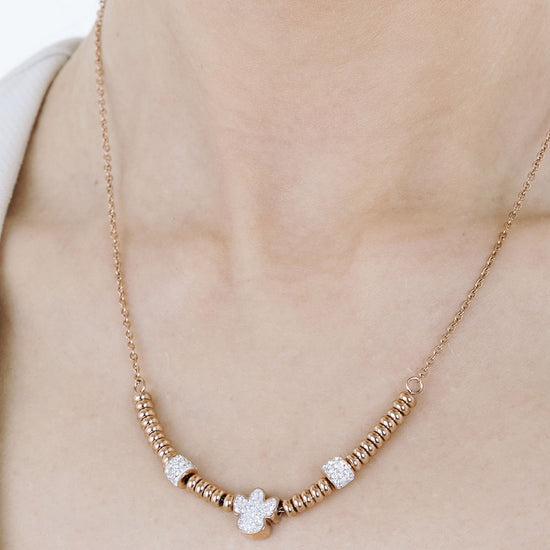 COLLAR DE ACERO IP ROSA CON ÁNGEL CON CRISTALES BLANCOS