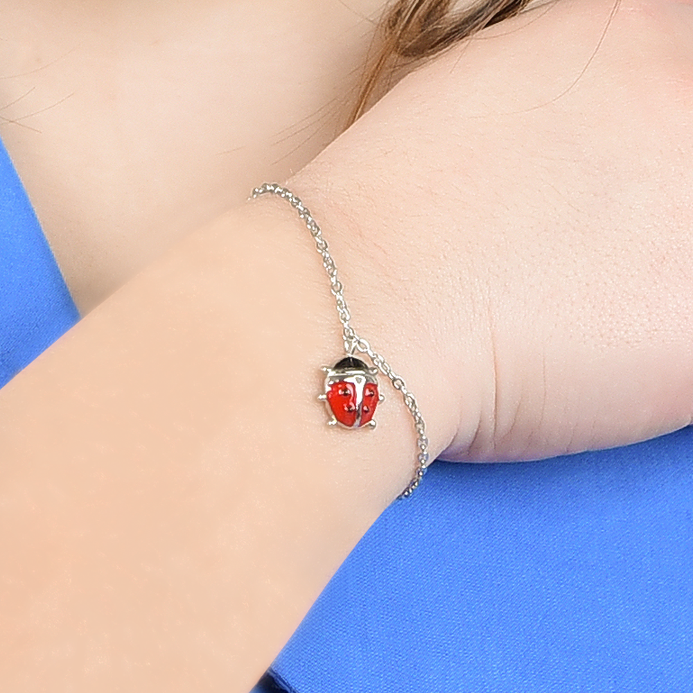 PULSERA DE ACERO NIÑA CON MARIQUITA