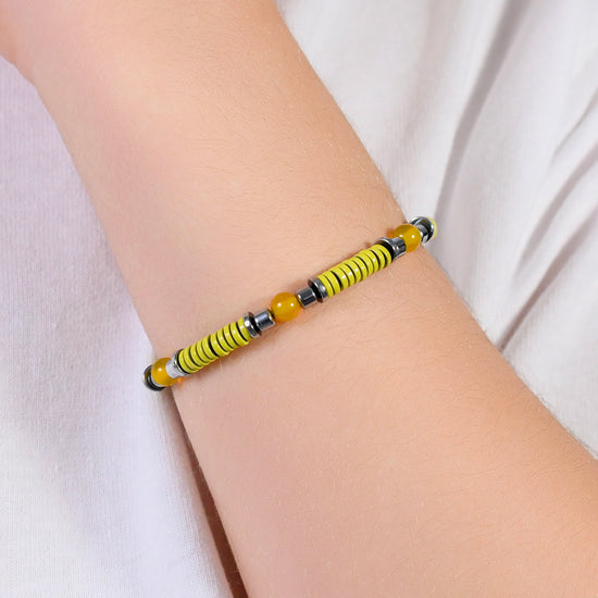 PULSERA DE ACERO PARA NIÑA CON PIEDRAS AMARILLAS Y ELEMENTOS DE ESMALTE AMARILLO