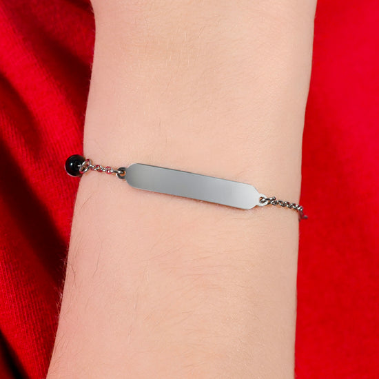 PULSERA DE ACERO PARA BEBÉ CON PIEDRAS BLANCAS Y NEGRAS