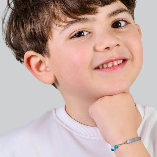PULSERA DE ACERO PARA BEBÉ CON PIEDRAS AZULES Y BLANCAS