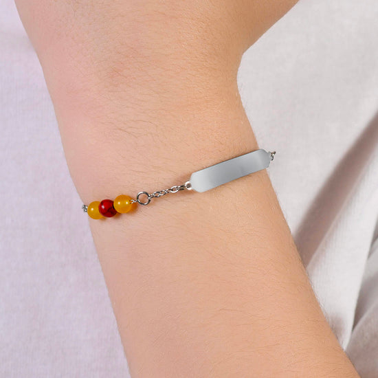 PULSERA DE ACERO PARA BEBÉ CON PIEDRAS AMARILLAS Y ROJAS