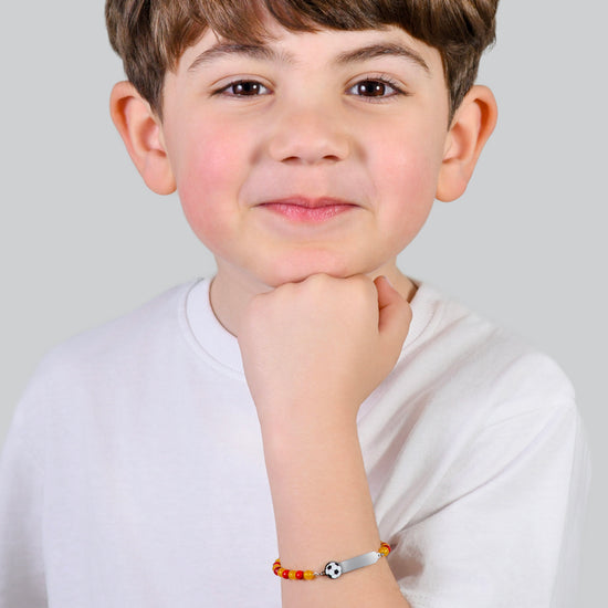 PULSERA DE ACERO PARA BEBÉ CON PIEDRAS ROJAS Y AMARILLAS
