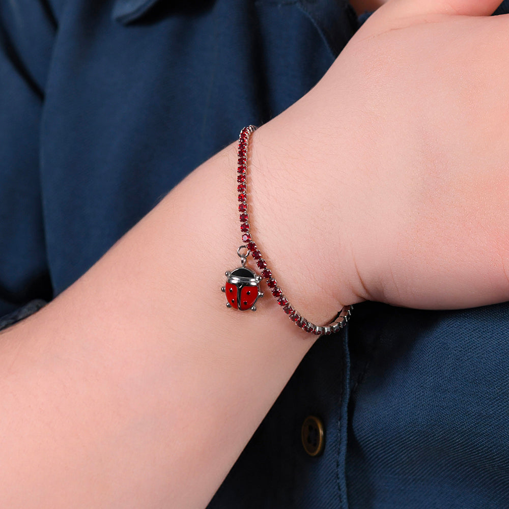 PULSERA DE TENIS DE ACERO PARA NIÑA CON CRISTALES ROJOS Y MARIQUITA