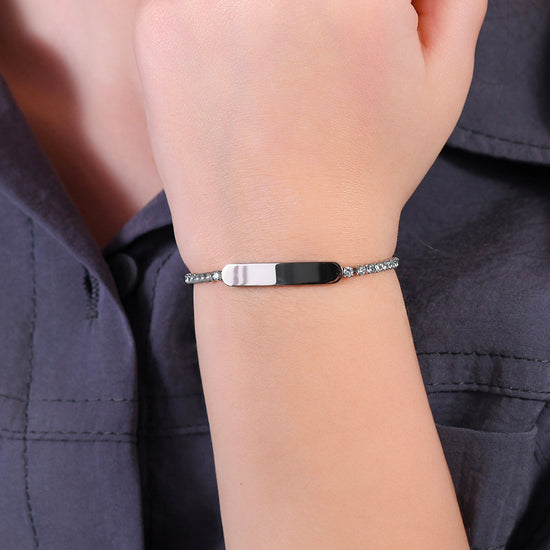 PULSERA DE TENIS DE NIÑA DE ACERO CON CRISTALES BLANCOS Y PLACA