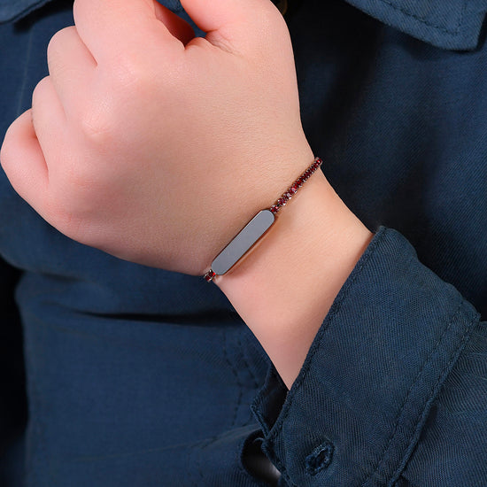 PULSERA DE TENIS DE NIÑA DE ACERO CON CRISTALES ROJOS Y PLACA