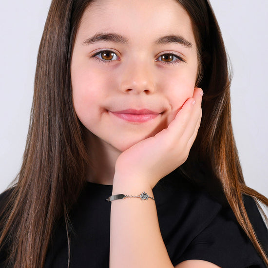 PULSERA DE NIÑA DE ACERO CON PLACA Y CORONA CON CRISTALES BLANCOS