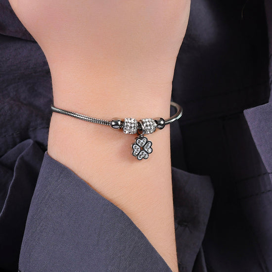 PULSERA DE ACERO PARA NIÑA CON TRÉBOL DE CUATRO HOJAS CON CRISTALES BLANCOS