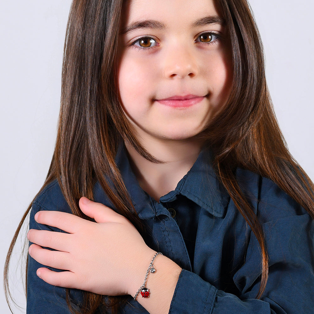 PULSERA DE ACERO PARA NIÑA CON MARIQUITA ESMALTADA EN ROJO Y NEGRO Y CRISTAL