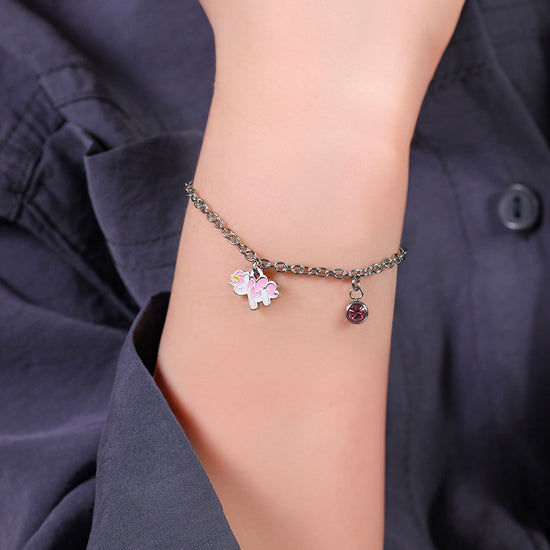 PULSERA UNICORNIO DE ACERO CON ESMALTE ROSA Y BLANCO Y CRISTAL