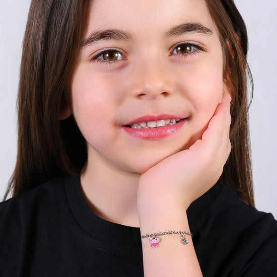 Subir imagen a la Galería PULSERA BABY EN ACERO CON MARIPOSA CON ENAMEL ROSA Y CRISTAL BLANCO
