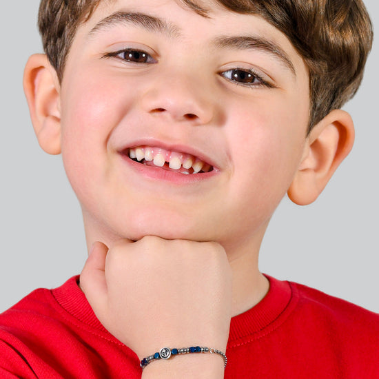 PULSERA DE ACERO PARA BEBÉ CON HEMATITES AZUL Y ANCLA