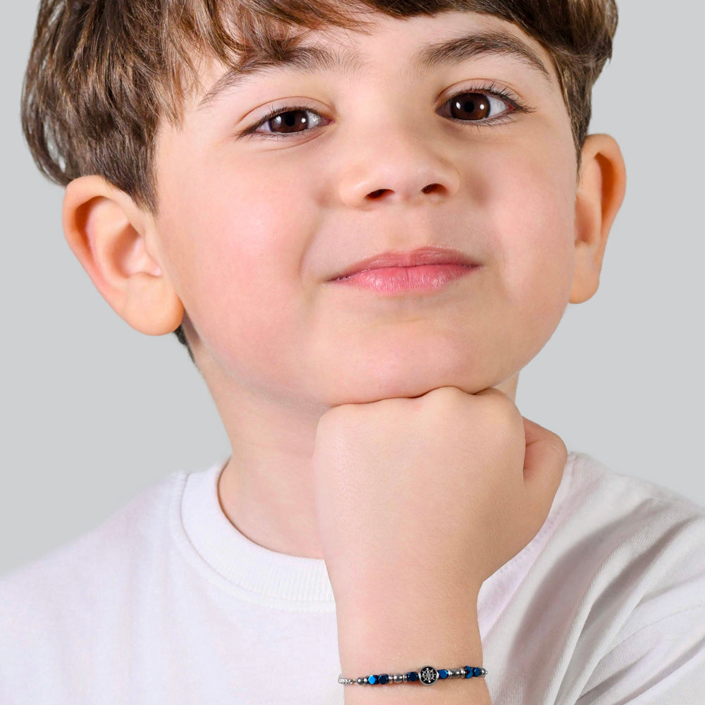 PULSERA DE ACERO PARA BEBÉ CON HEMATITES AZUL Y TIMÓN