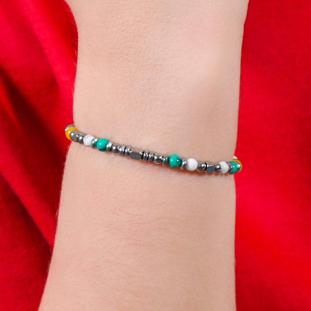 PULSERA DE ACERO PARA BEBÉ CON PIEDRAS MULTICOLORES