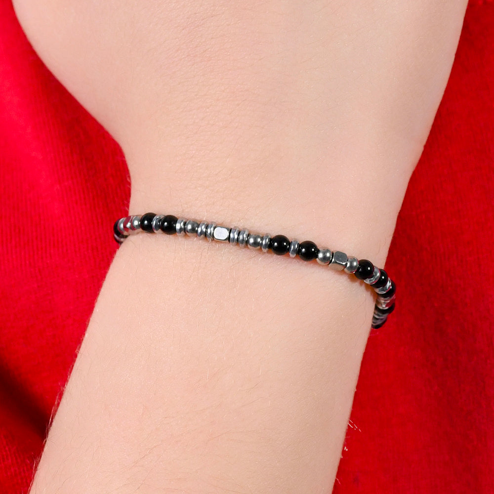 PULSERA DE ACERO PARA BEBÉ CON PIEDRAS NEGRAS Y GRISES