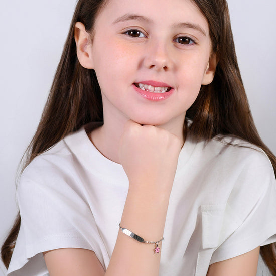 Carica immagine nella Galleria BRACCIALE BAMBINA IN ACCIAIO SMALTO ROSA E PIASTRA
