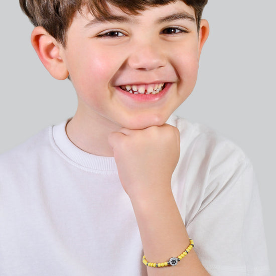 PULSERA RUDDER BABY DE ACERO CON PIEDRAS AMARILLAS