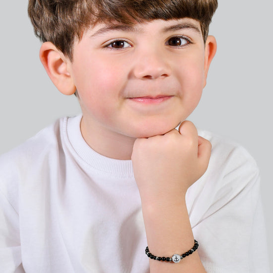 PULSERA BEBE ANCLA DE ACERO CON PIEDRAS NEGRAS