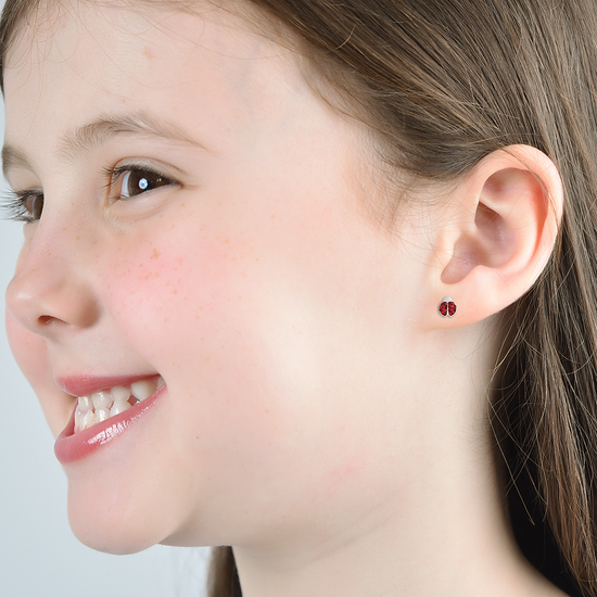 PENDIENTES DE NIÑA DE ACERO CON MARIQUITA Y CRISTALES ROJOS